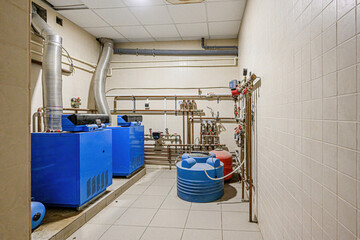 interior apartment room boiler room. heating system, pipes and appliances