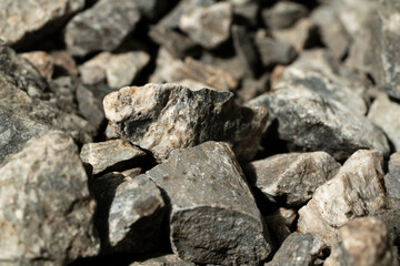Closeup of rough, textured, black coal, reminiscent of ancient stone architecture
