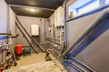 interior apartment room boiler room. heating system, pipes and appliances