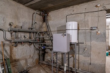 interior apartment room boiler room. heating system, pipes and appliances