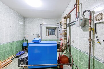 interior apartment room boiler room. heating system, pipes and appliances