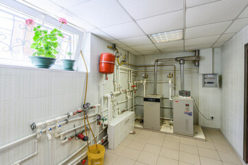 interior apartment room boiler room. heating system, pipes and appliances