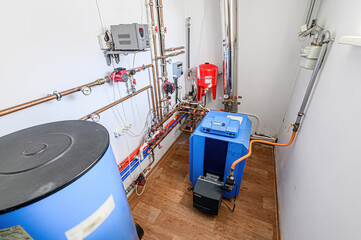 interior apartment room boiler room. heating system, pipes and appliances