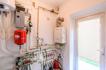 interior apartment room boiler room. heating system, pipes and appliances