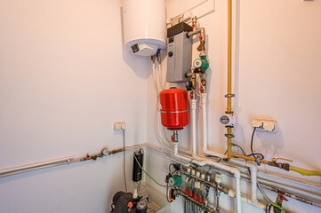 interior apartment room boiler room. heating system, pipes and appliances