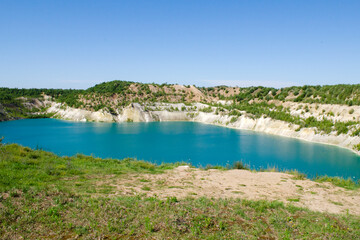Volkovysk chalk quarries or Belarusian Maldives. Famous chalk quarries near Volkovysk, Belarus. Abandoned quarry with a beautiful lake. Beautiful saturated blue lakes with sky, landscape.