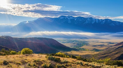 Breathtaking misty mountains scenic valleys nature photography sunlit environment wide-angle view captivating landscape