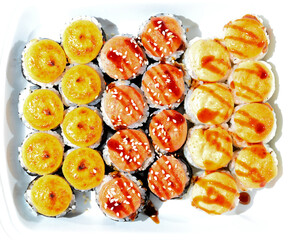 Japanese sushi in a white shipping container. View from above