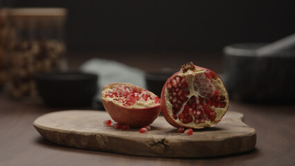 small pomegranate on wood board