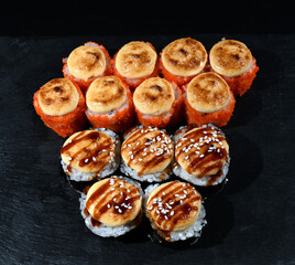 Japanese sushi on a black stand. View from above
