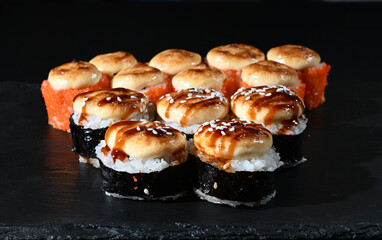 Japanese sushi on a black stand. View from above