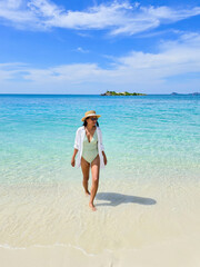 Relaxing by the tranquil shores of Samae San Island in Thailand on a sunny day
