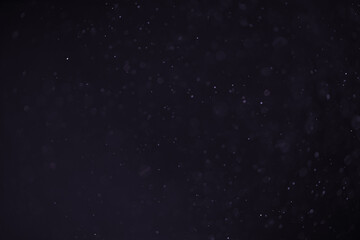 abstract dust particles over black background for overlay