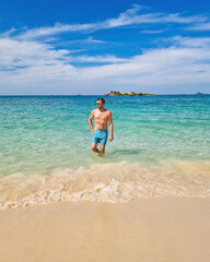 Sunny day at Samae San Island in Thailand with tranquil waters and bright blue skies