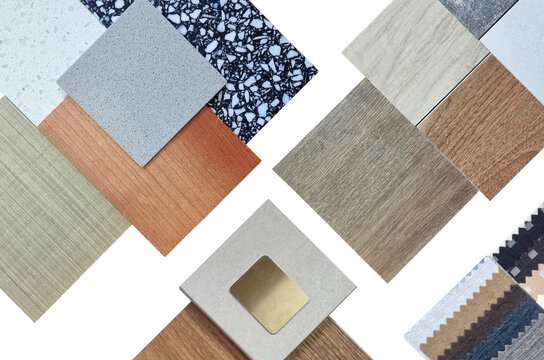 palette of interior material samples in top view contains wooden tiles, artificial stone, terrazzo, gold stainless, drapery, laminated isolated on background with clipping path. selected materials.