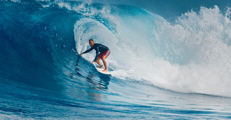 Pro surfer rides big wave in the Maldives