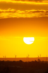 sunset behind the wind turbines in the Essaouira region in Morocco