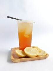 Fototapeta premium iced lemon tea packaged in a plastic cup on a white background