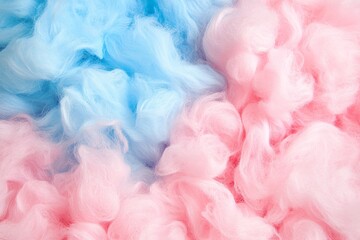 Fototapeta premium Soft clouds create a dreamy cotton candy texture in pink and blue hues resembling a whimsical dessert experience