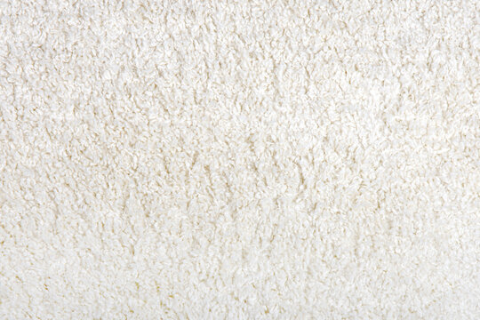 Texture of soft white pile carpet. Close-up. Textures.