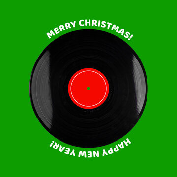 Vinyl record, on a green background. Merry Christmas and Happy New Year. Festive musical card. Musical