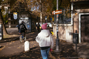 Embarking on a Leisurely Walk Through Autumn Streets Filled with Vibrant Colorful Leaves