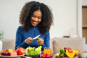 Fit woman enjoys healthy fruit breakfast after yoga training. fitness, nutrition, home lifestyle.