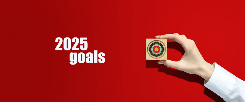2025, Goals. Motivational poster with a goal in a woman's hand, on a red background. Goals and plans for the next year. Business. Lifestyle. Motivation.