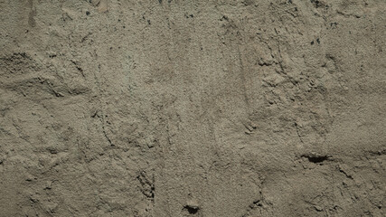 brown concrete wall with plaster close up