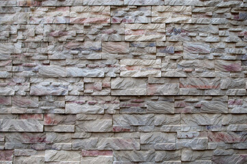 The photo shows decorative facing tiles in the form of bricks