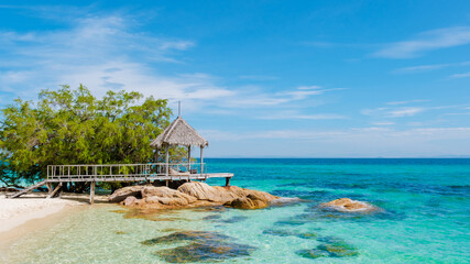 Explore the serene beauty of Koh Munnork Island in Rayong, Thailand on a sunny day