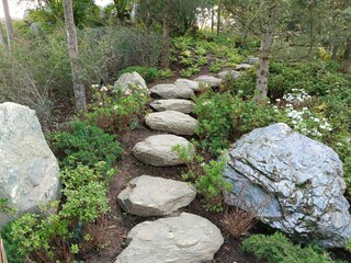 A stone walking trail in a Japanese garden.