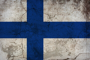 The Finnish flag painted on grunge wall. Finland Independence Day 6th of December.