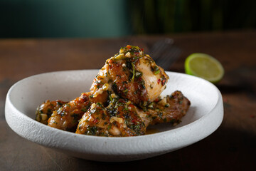 Chicken legs fried with garlic and parsley