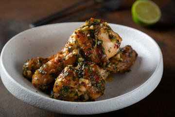 Chicken legs fried with garlic and parsley