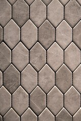 Textured gray stone surface with polished diamond tile arrangement