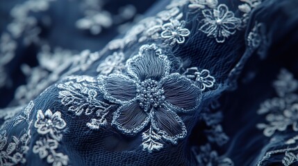 Obraz premium Close-up of Exquisite Blue Lace Fabric with Intricate Floral Embroidery