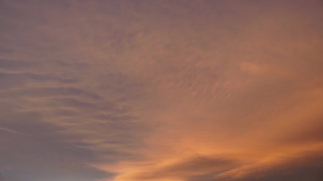 Video of the clouds with the different colors that occur at sunset. See the red color gradients in the sky