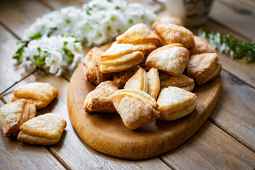 Sugar cookies for dessert on a wooden table. Delicious cookies for breakfast. Close-up