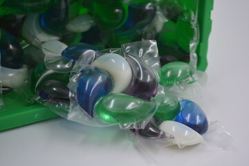 Things, objects for daily use, cleansing. Round polyethylene capsules filled with white, blue,...