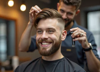 Gordijnen Happy client smiling while getting haircut by barber © Cozy Coffee Bar