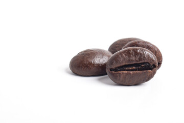 Roasted coffee beans isolated on white background.