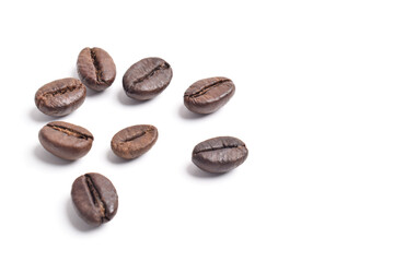 Many roasted coffee beans isolated on white background, top view