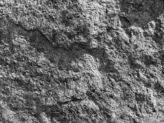 Gray monochrome texture of rough rock surface background.