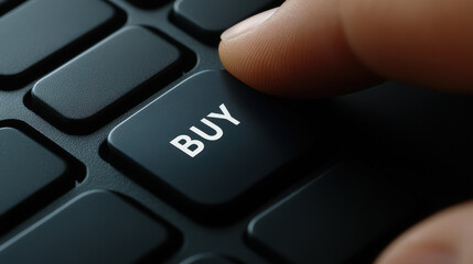 Close up of a finger pressing a buy button on keyboard