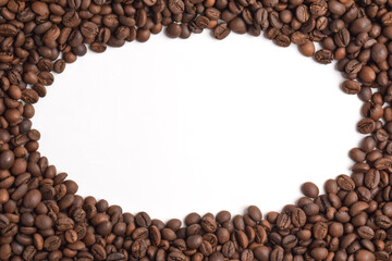 Frame of roasted coffee beans on white background, top view