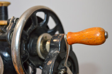 old vintage sewing machine faded decorative patterns restoration renewal craftsmanship tradition manual skills tidying up care nostalgia history USSR upcycling sustainability reusing repairing item 