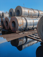 A roll of sheet iron. Hot rolled steel rolls are stored outdoors. Rolls of steel sheet. Sheet metal in the port. Steel rolls are available in stock. Steel rolls. A roll of sheet iron.