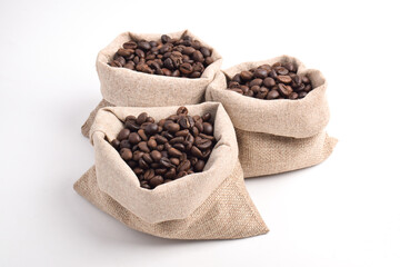 Roasted coffee bean in sack bag isolated on white background.