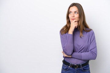 Young caucasian woman isolated on white background thinking an idea while looking up